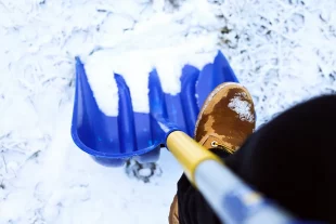 man-worker-uniform-shoveling-snow-close-up-image man-worker-uniform-shoveling-snow-close-up-image